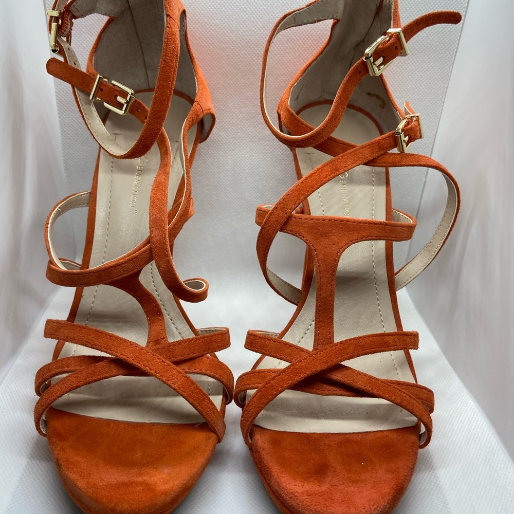 Orange/tangerine color 6 in. Heels. Slightly worn